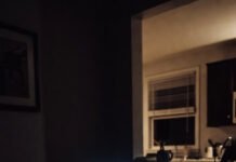 How to Get Leads Without Paid Ads (Easy Methods) Chaotic night desk in an American kitchen, laptop glowing amid scattered notes and coffee.