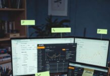 10 Content Optimization Tools You Should Be Using Cluttered desk with three laptops showing SEO dashboards, half-eaten pizza slice, sticky note saying “fix this crap before publish,” tiny frustrated ghost, and coffee stain graph — tired SEO hustle vibes.