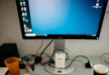 Content Optimization Checklist: From Draft to Publish Cluttered desk tilted overhead view