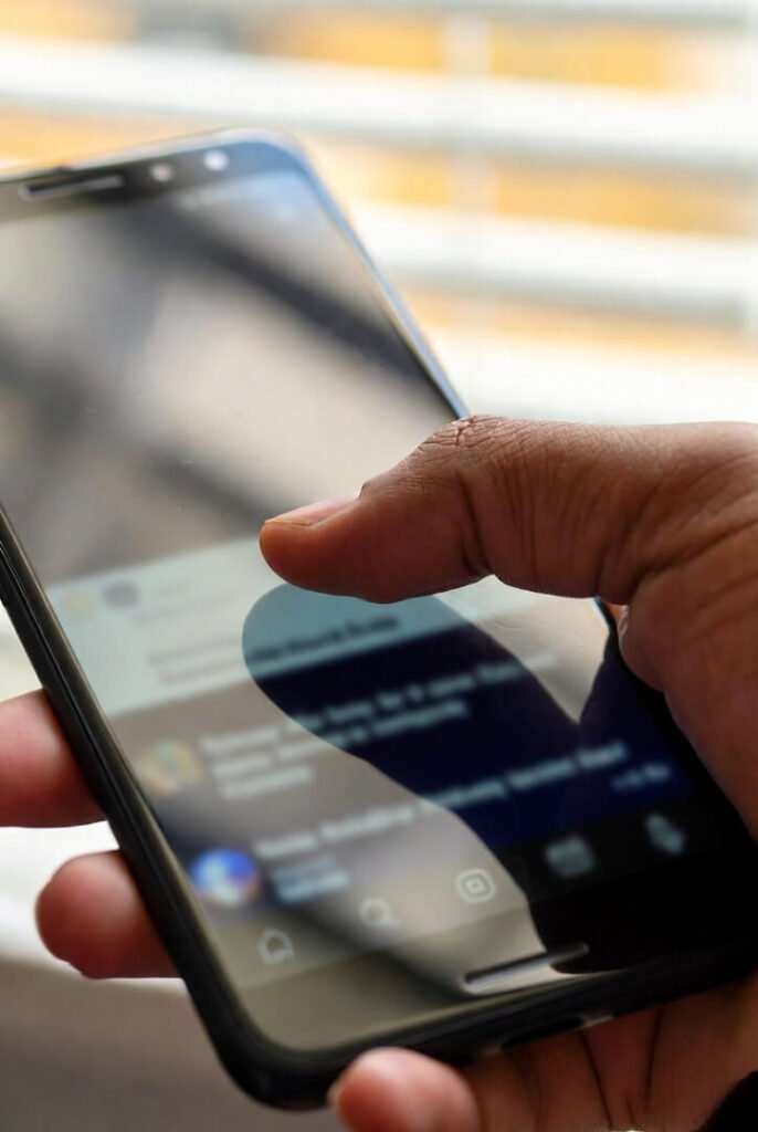 Candid thumb reaching awkwardly during phone scroll