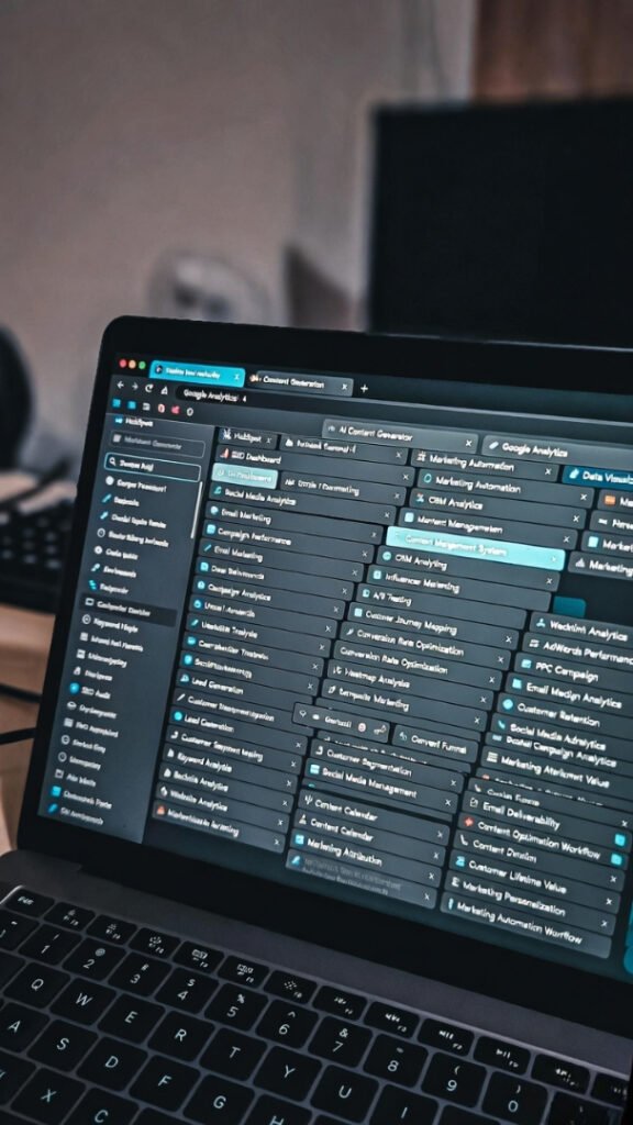 My messy martech stack: 27 tangled tabs of HubSpot, GA4, and AI tools overwhelming the laptop screen (POV shot).