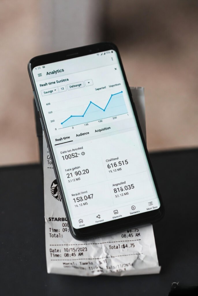 Sloppy phone screenshot of real-time Google Analytics atop crushed receipt (9 words)