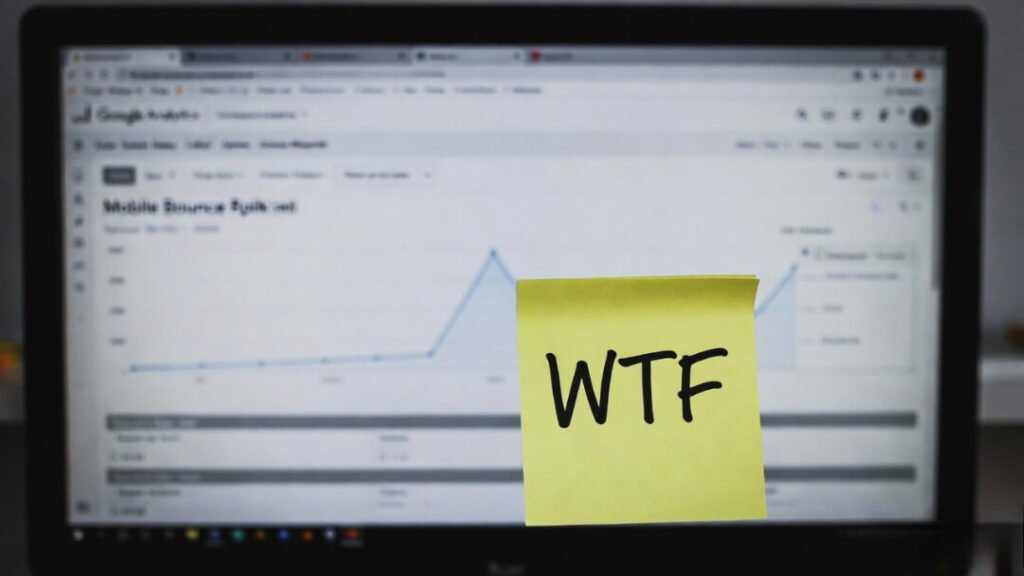 Blurry chart of skyrocketing bounce rate and frustrated sticky note