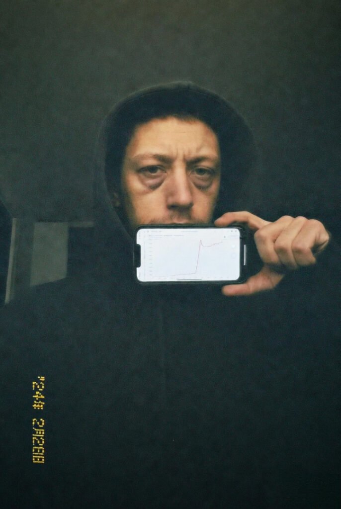 Grainy self-portrait: me owning the churn disaster, pointing at steep spike with tired expression.